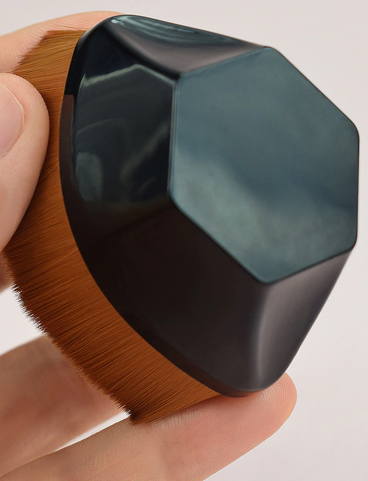 This hexagonal three-dimensional foundation Makeup Brush will give you a soft silky feel on the skin. Made of non-harmful synthetic fiber and has densely packed bristles to provide a high-definition finish. Can be used with liquid, powder, or cream foundation without absorption. Made with synthetic fiber, so it is safe for sensitive skin. The 3D square handle is ergonomically designed and allows for a comfortable and easy grip. It comes with a storage box, making it easy for travel